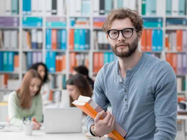 Student posing with books — Stock Photo, Image