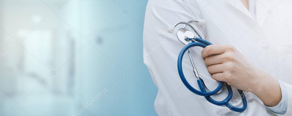 Professional female doctor posing and holding a stethoscope, healthcare professionals