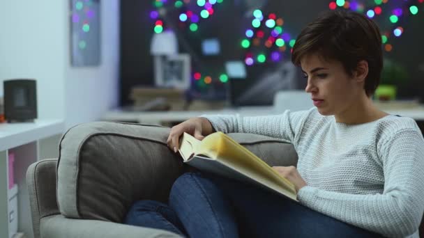 Woman Relaxing Couch Home Reading Book She Turning Pages — Stock Video