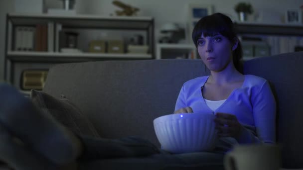 Young Smiling Woman Relaxing Sofa Home She Watching Eating Popcorn — Stock Video