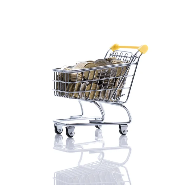 Shopping cart filled with currency — Stock Photo, Image