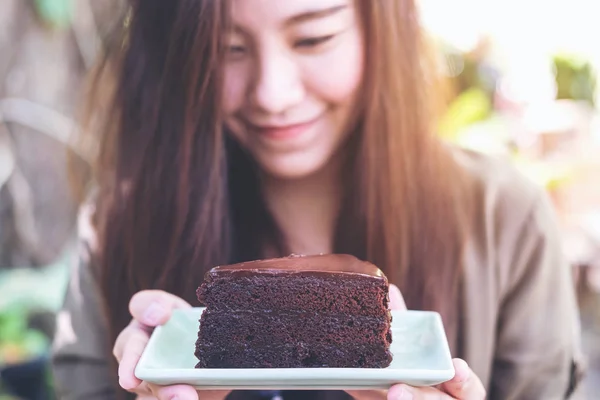 woman and brownie cake