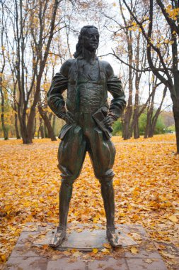 Moscow, Russia - October 7, 2019: Peter the Great monument on background of autumn trees and yellow foliage in Kolomenskoye park. Peter the Great was Russian Tsar and Emperor.