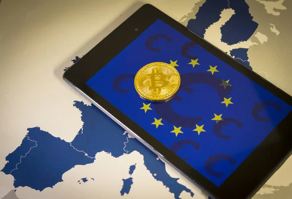 Financial concept with golden Bitcoin over smartphone, with EU flag, symbol and map — Stock Photo, Image