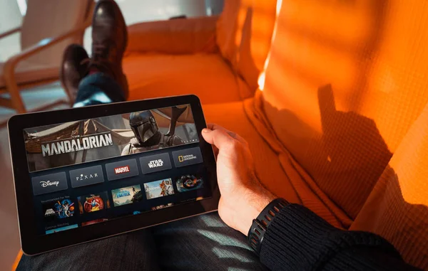 Barcelona, Spain. January 2019: Man holds a tablet with the new Disney plus on screen — Stock Photo, Image