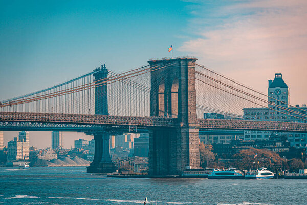 Teal and orange viwe of Brooklyn bridge in New York from Manhattan