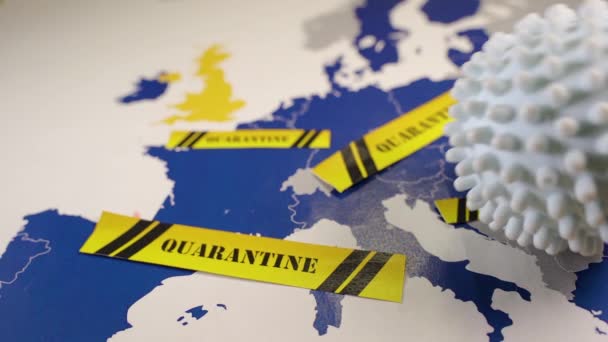 Coronavirus ball rolling over an EU map — ストック動画