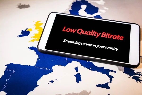 Smartphone with low bitrate message on screen over an EU map