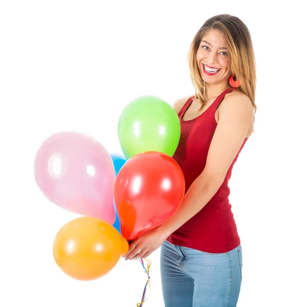 Pretty woman holding colorful balloons isolated on white background — Stock Photo, Image