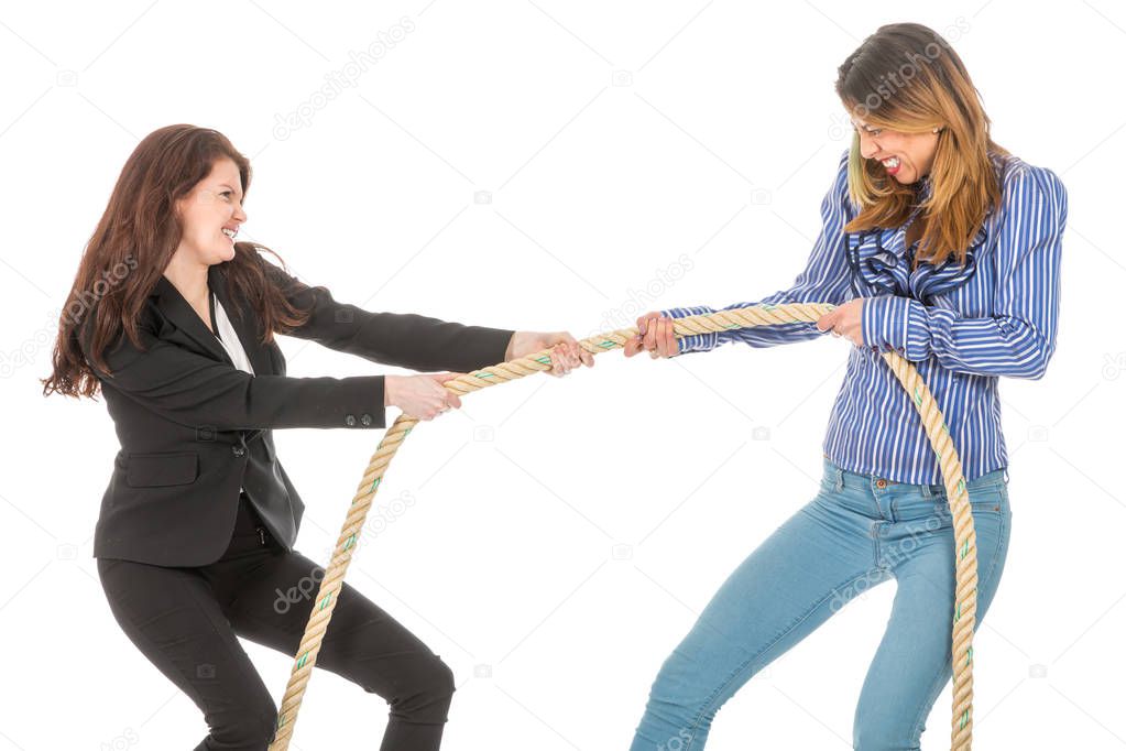 Two business woman pulling at a rope