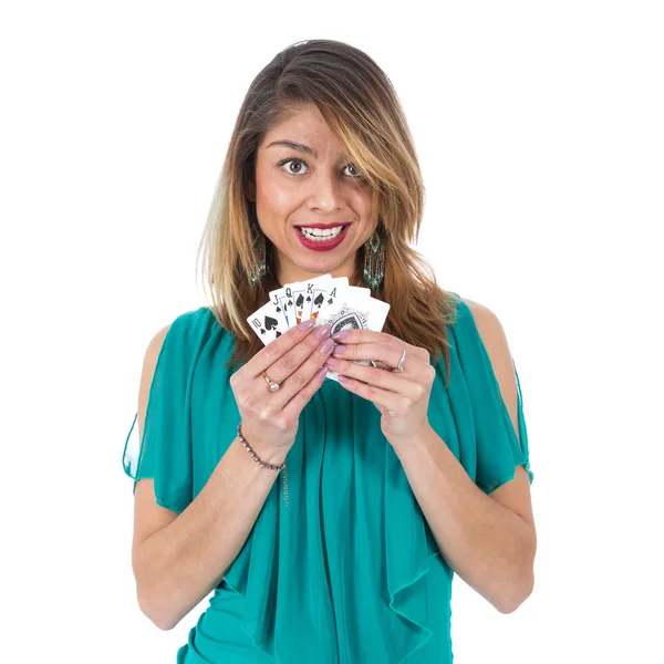 Beautiful Brazilian woman shows winning royal flush poker cards — Stock Photo, Image