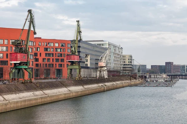 German inner harbour with port cranes in Duisburg — Stock Photo, Image