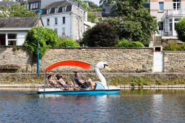 River Semois with family relaxing in pedalos in Belgian Bouillon clipart