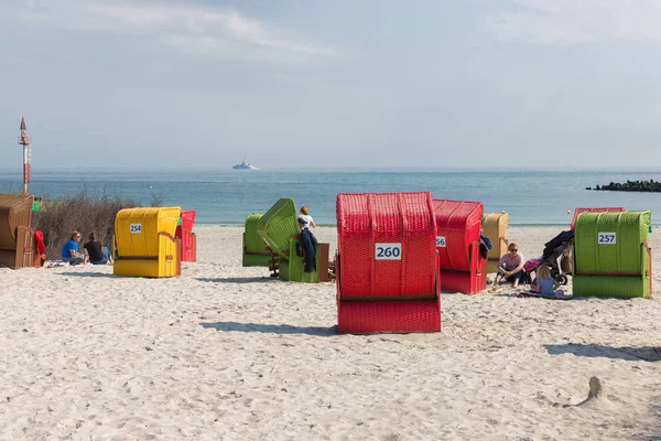 Seaside visitors in colorful beach chairs at German island Dune — Stock Photo, Image