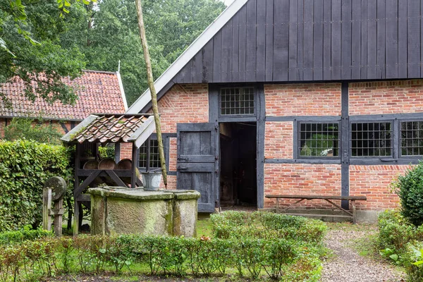Dutch rural open-air museum with shed and water well — Stock Photo, Image