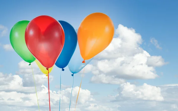 Colorful balloons for birthday and celebrations isolated at blue sky