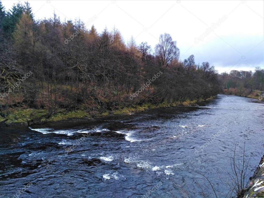 Nearly black river Teith in Deanston