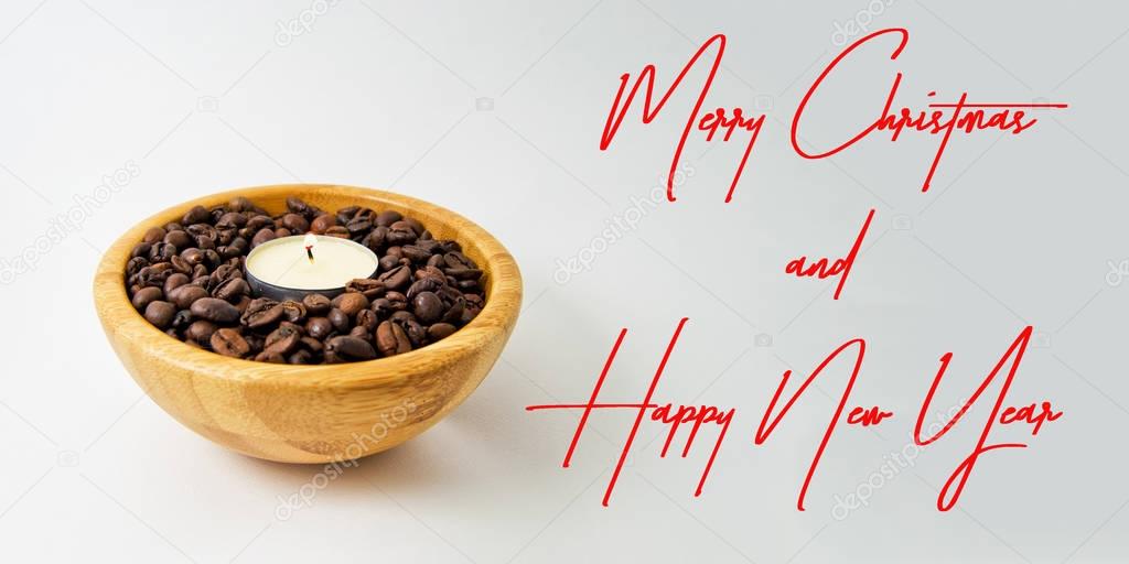 Merry Christmas and Happy New Year card with candle light in a wood cup with coffee beans. for season greetings concept