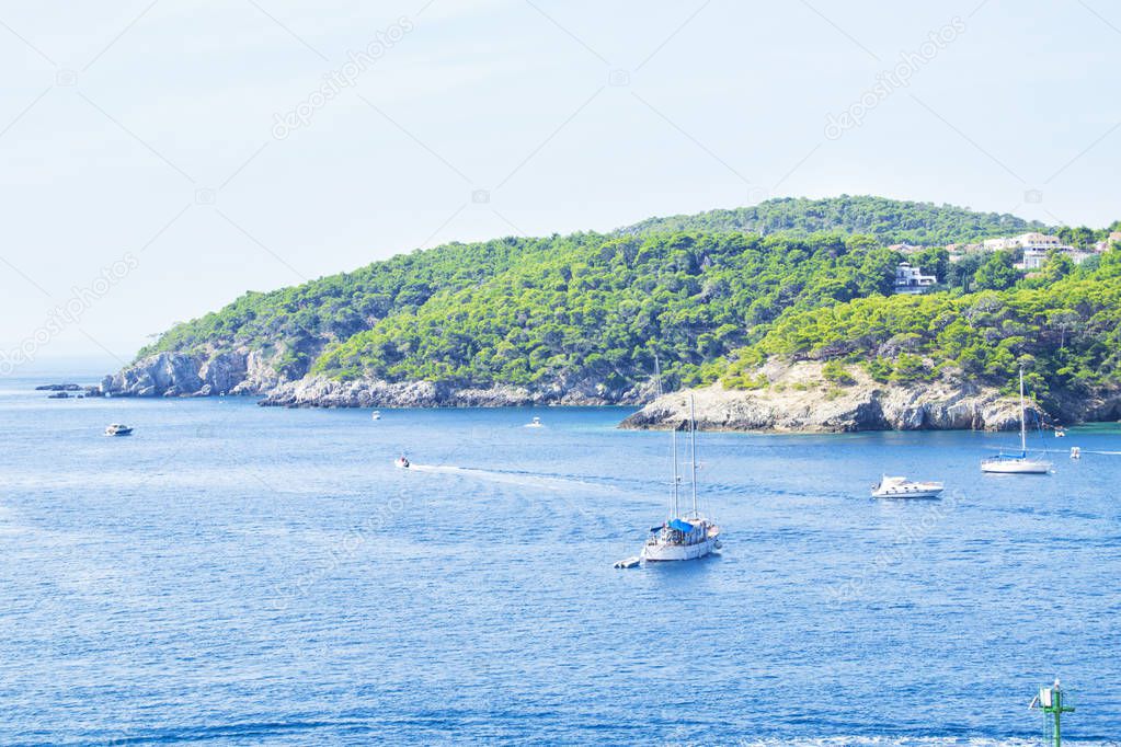 view of Tremiti islands with blue water, boats and clouds. Gargano. Puglia, Italy. for nature, travel and holyday concepts