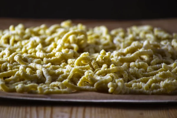 Making Italian traditional handmade and homemade passatelli pasta ロイヤリティフリーのストック写真