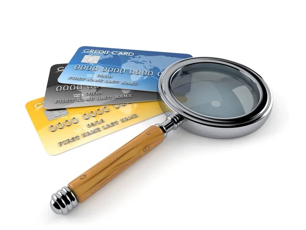 Credit cards with magnifying glass — Stock Photo, Image