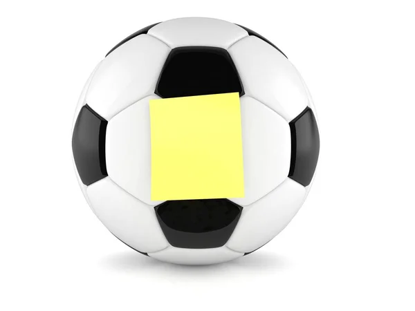 Bola de futebol com adesivo amarelo em branco — Fotografia de Stock