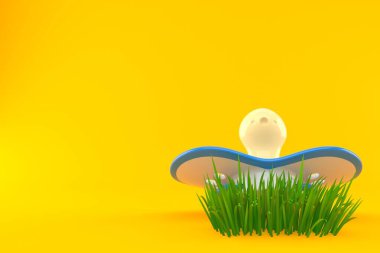 Çimlerde bebek kuklası