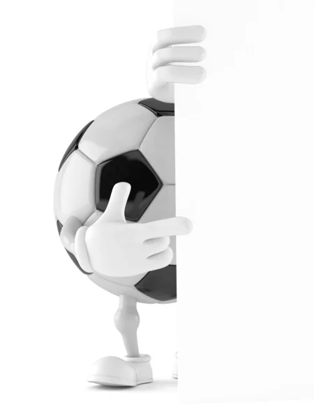 Soccer ball character pointing finger behind white wall — Stock Photo, Image