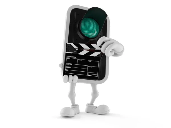 Groene verkeerslicht karakter holding clapboard — Stockfoto