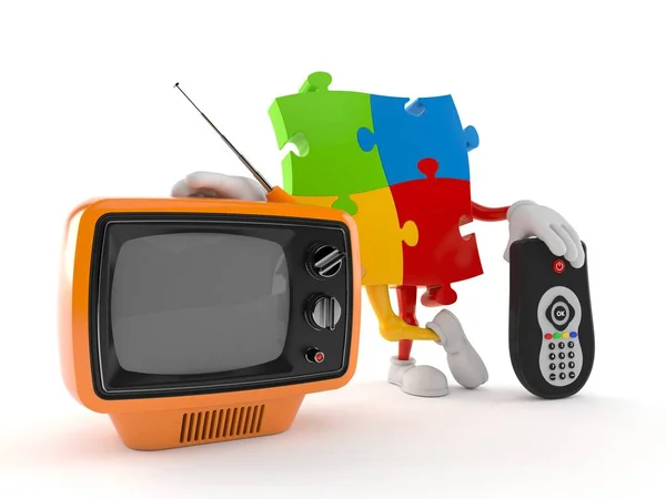 Jigsaw puzzle character with tv set and remote — Stock Photo, Image