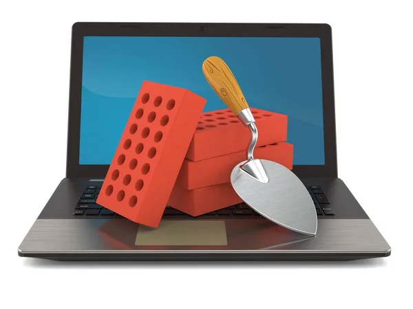 Trowel and bricks with laptop — 스톡 사진