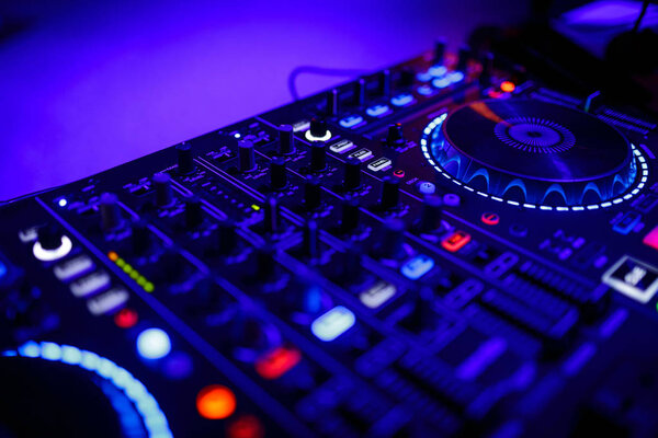 closeup view of a DJs mixing desk