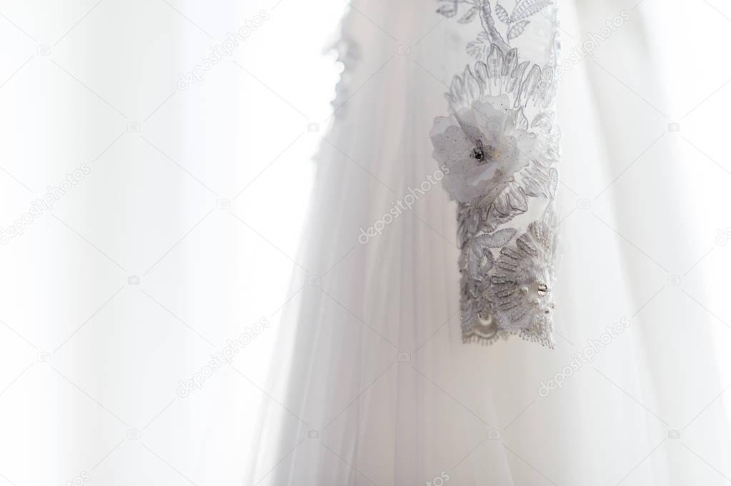 White wedding dress. Wedding detail photography