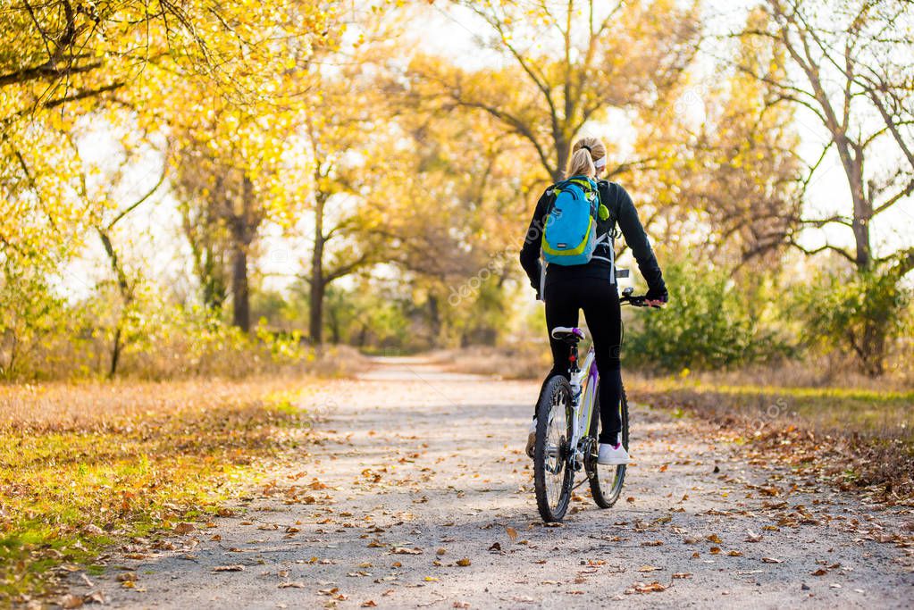 riding a bike with a backpack