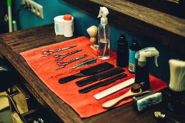 Barber tools. Side view of barbershop tools lying on the wood grain