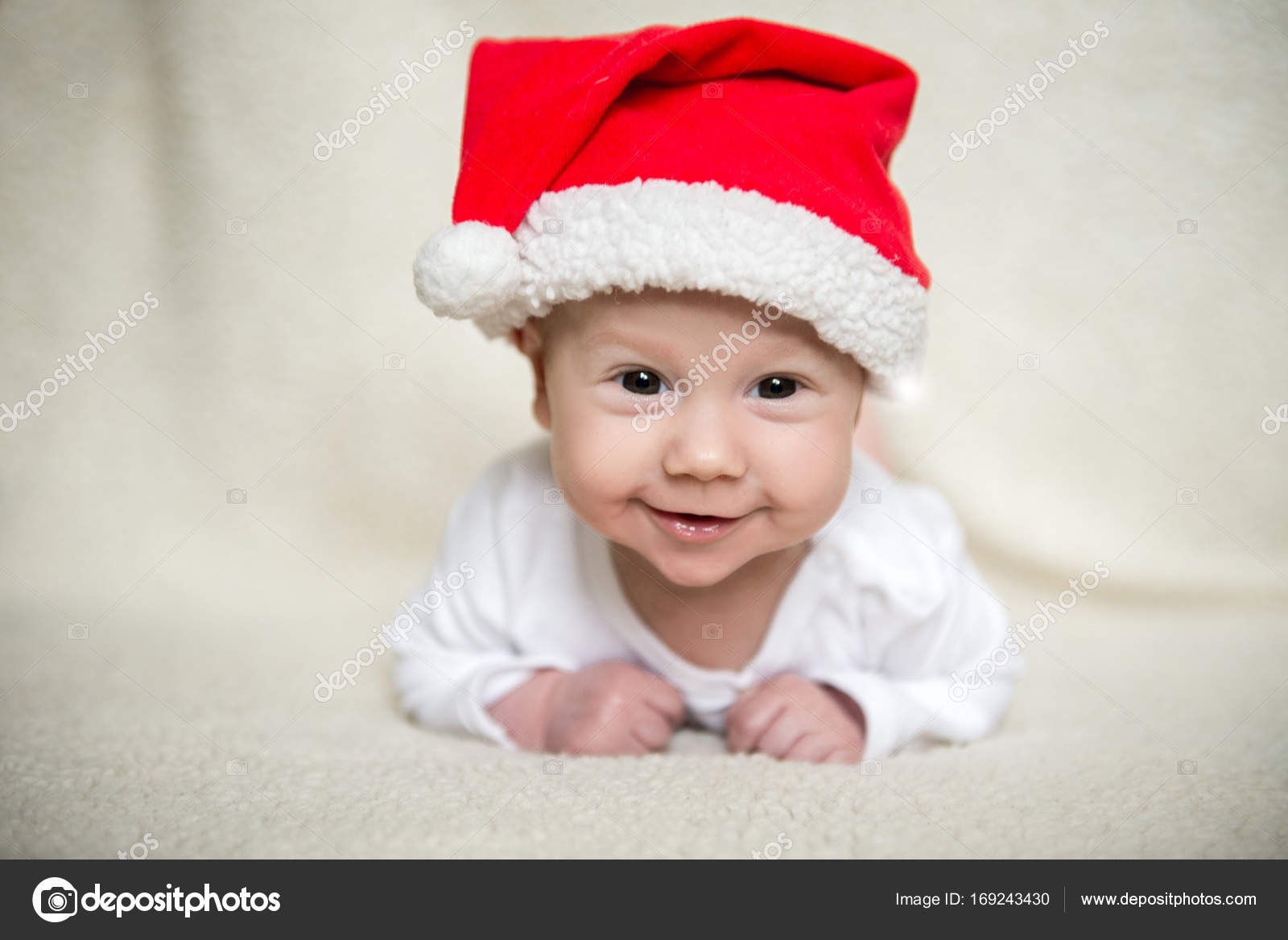 Little baby in red cap of Santa Claus celebrates Christmas. Christmas