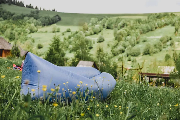 Inflatable chaise longue lamzac in the mountains in summer. Rest on the nature, a day off. — Stock Photo, Image