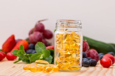 Fish oil, omega 3 with vitamin D capsules clipart