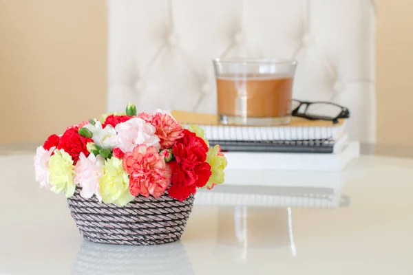 Colorful carnations in brown vase.