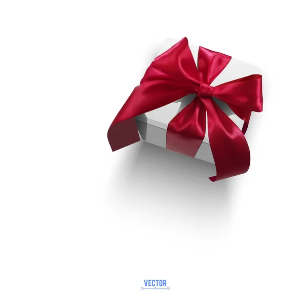 Boîte cadeau avec arc rouge — Image vectorielle