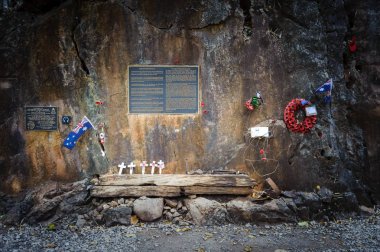 Peoples laid Australia flag, bead necklace and the boomerang to commemorate POWs at Hellfire Pass of Death Railway, Kanchanaburi, Thailand clipart