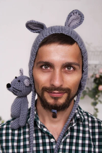 Portrait of a young daddy in a children's hat with ears and a mouse on his shoulder — Stock Photo, Image