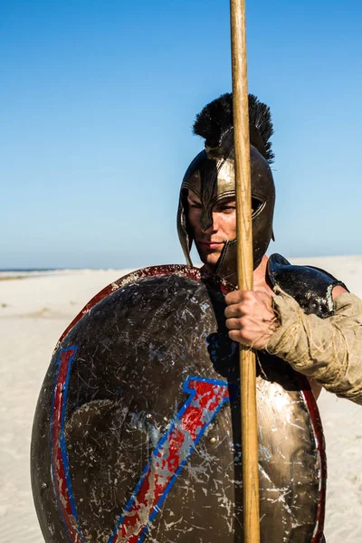 Portrait of a Spartan warrior with an ancient shield — Stock Photo, Image