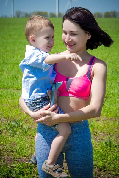 Sports mom with baby