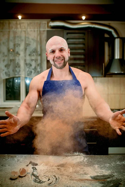 A young man chefs throw flour — Stock Photo, Image