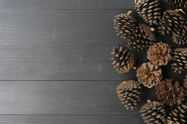 Pine Cones Black Wooden Table Background — Stock Photo, Image