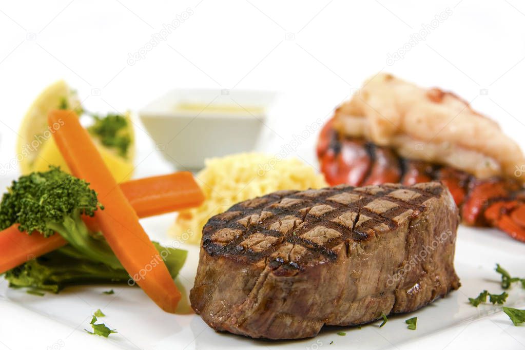 steak and lobster with vegetables