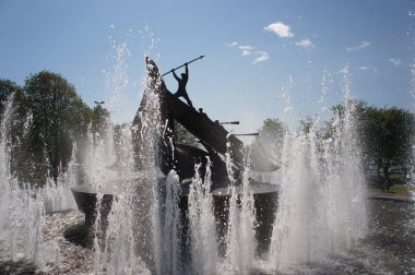 Fountain statue giving honours to the history of whaling in Sandefjord, Norway clipart