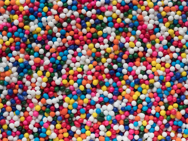 Bunte nonpareils Süßigkeiten Hintergrund — Stockfoto