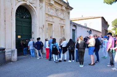 Tourists peeps into the keyhole of the Villa Magistrale dei Cavalieri di Malta. clipart